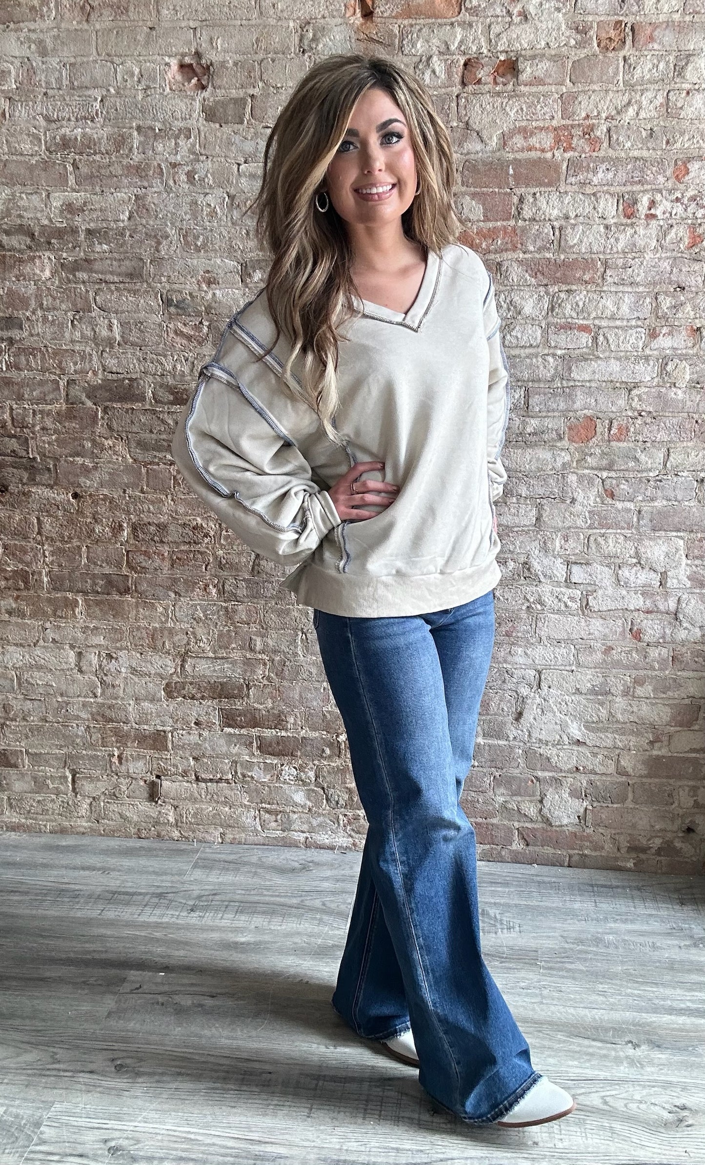 V Neck Lined French Terry Knit Sweatshirt with Exposed Seam Detail and Button Sleeve