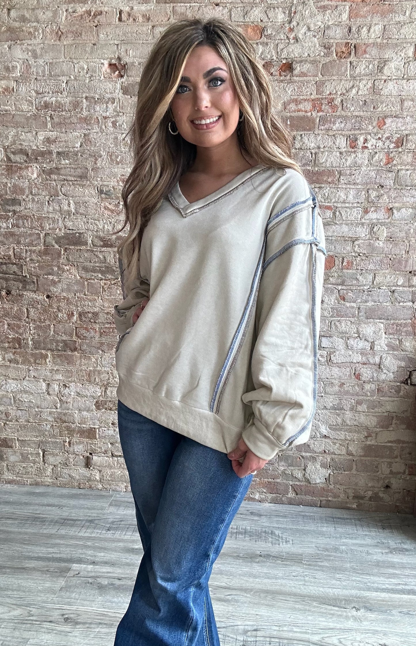 V Neck Lined French Terry Knit Sweatshirt with Exposed Seam Detail and Button Sleeve